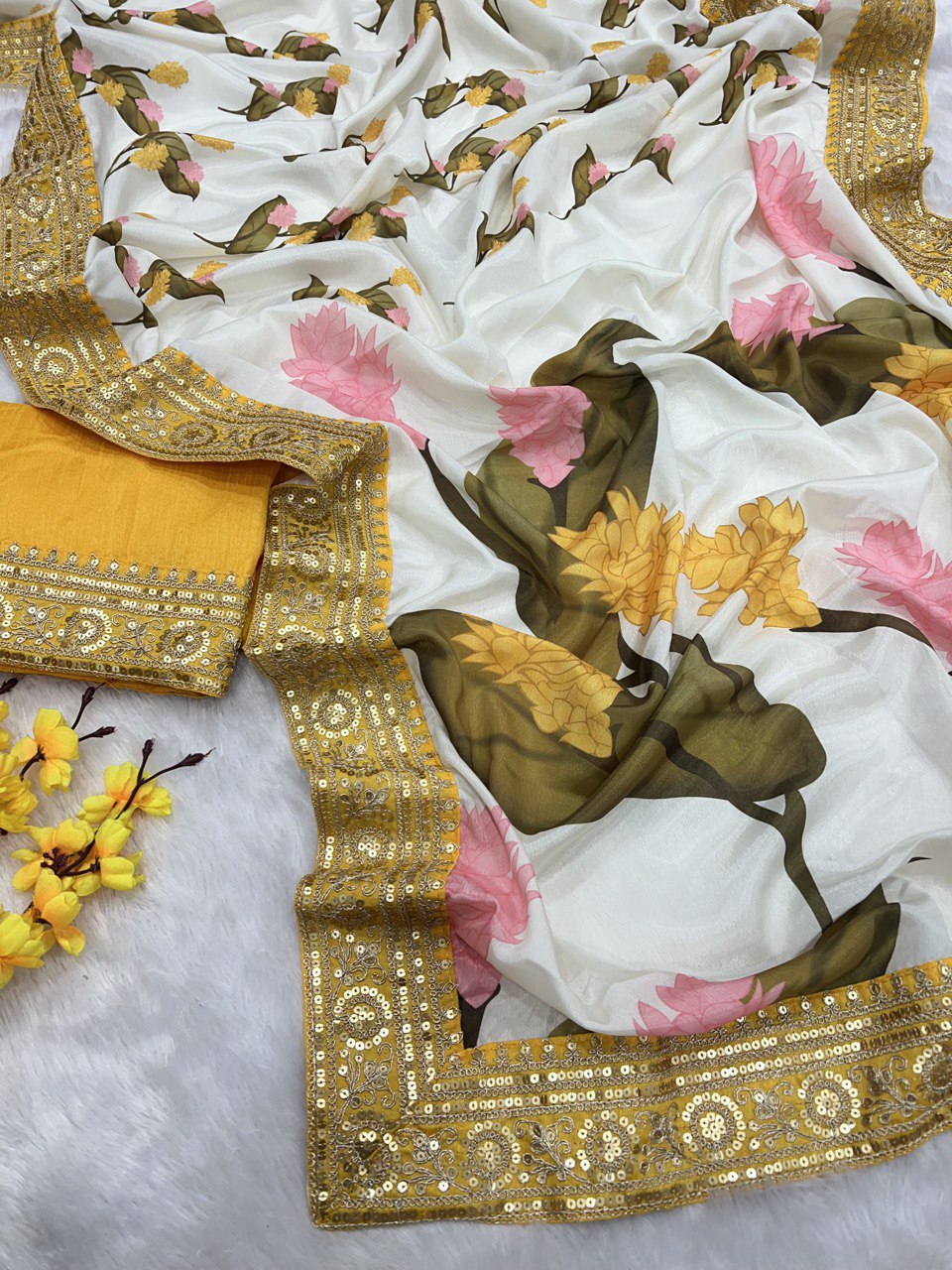 Crafted from luxurious heavy soft Chinnon, adorned with exquisite floral prints Saree